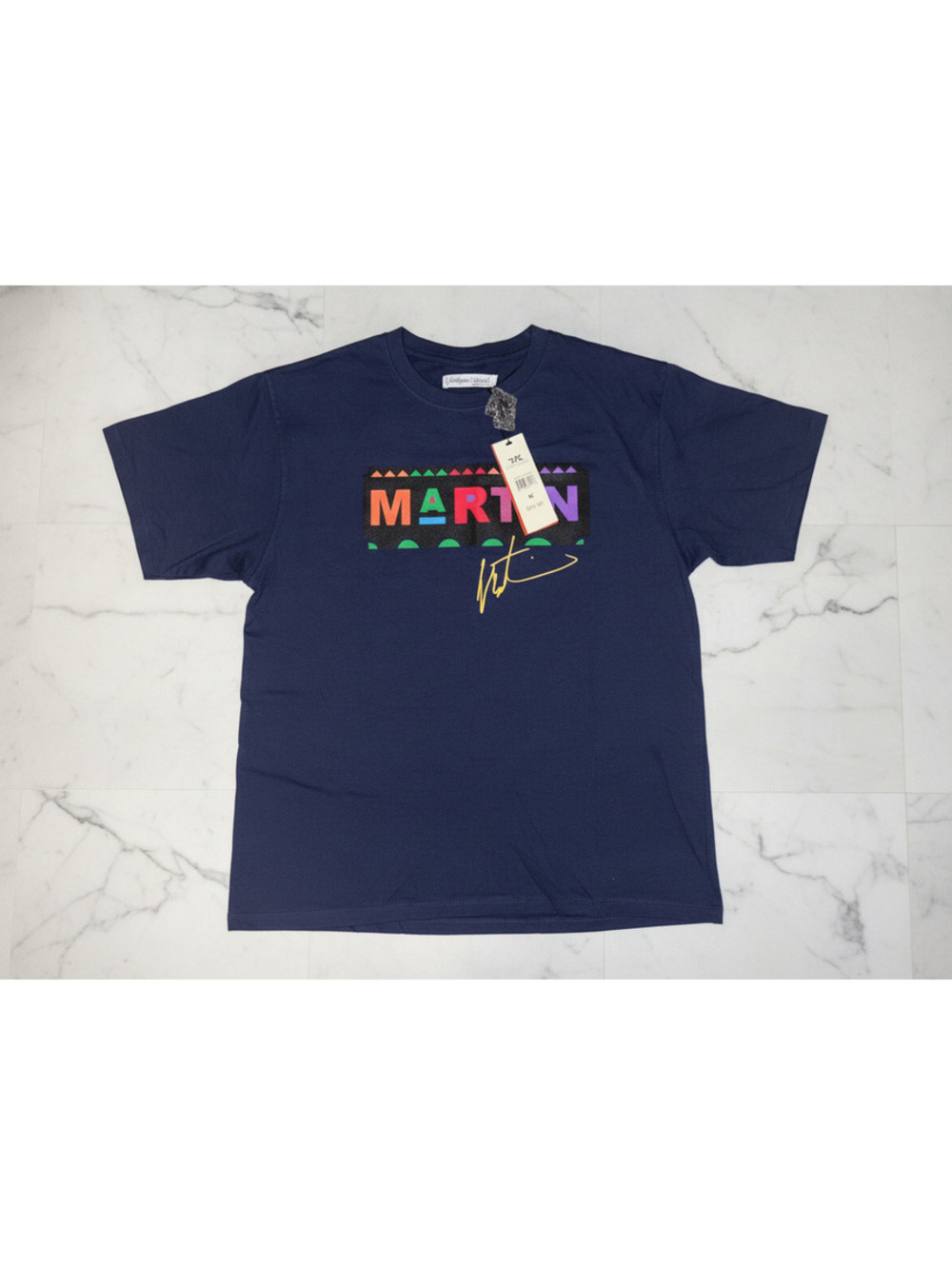 MED MARTIN “WAZZUP” NAVY T-SHIRT $32